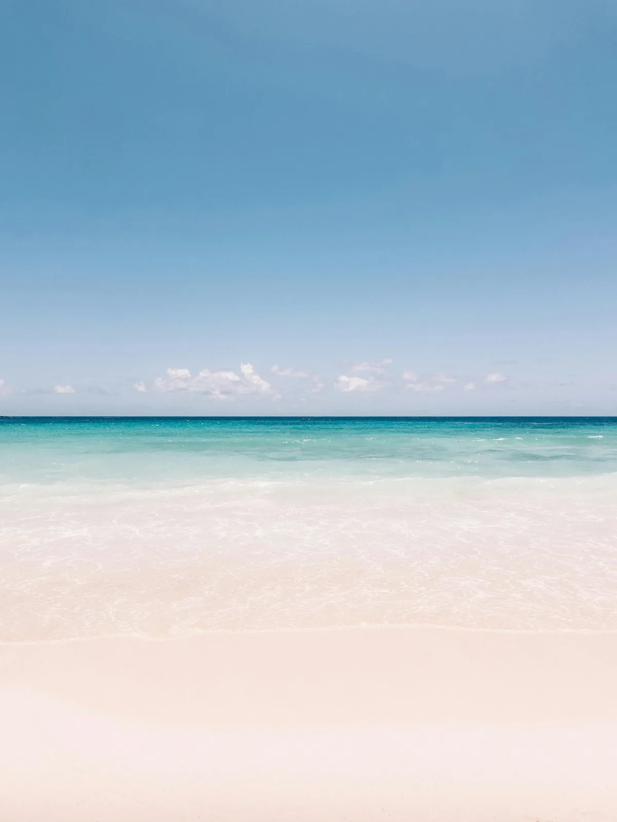 Pale sand and clear turquoise water on the Barbados coast