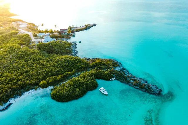 An aerial view of the coastline and turquoise water in Exuma, Bahamas.