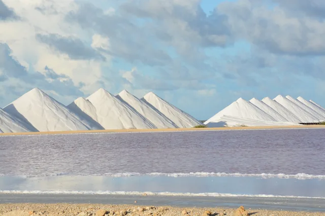 Salt mountains and pink water at Pekelmeer, Bonaire.