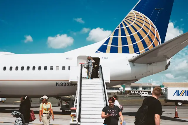 Passengers beside an aircraft at Punta Cana International Airport