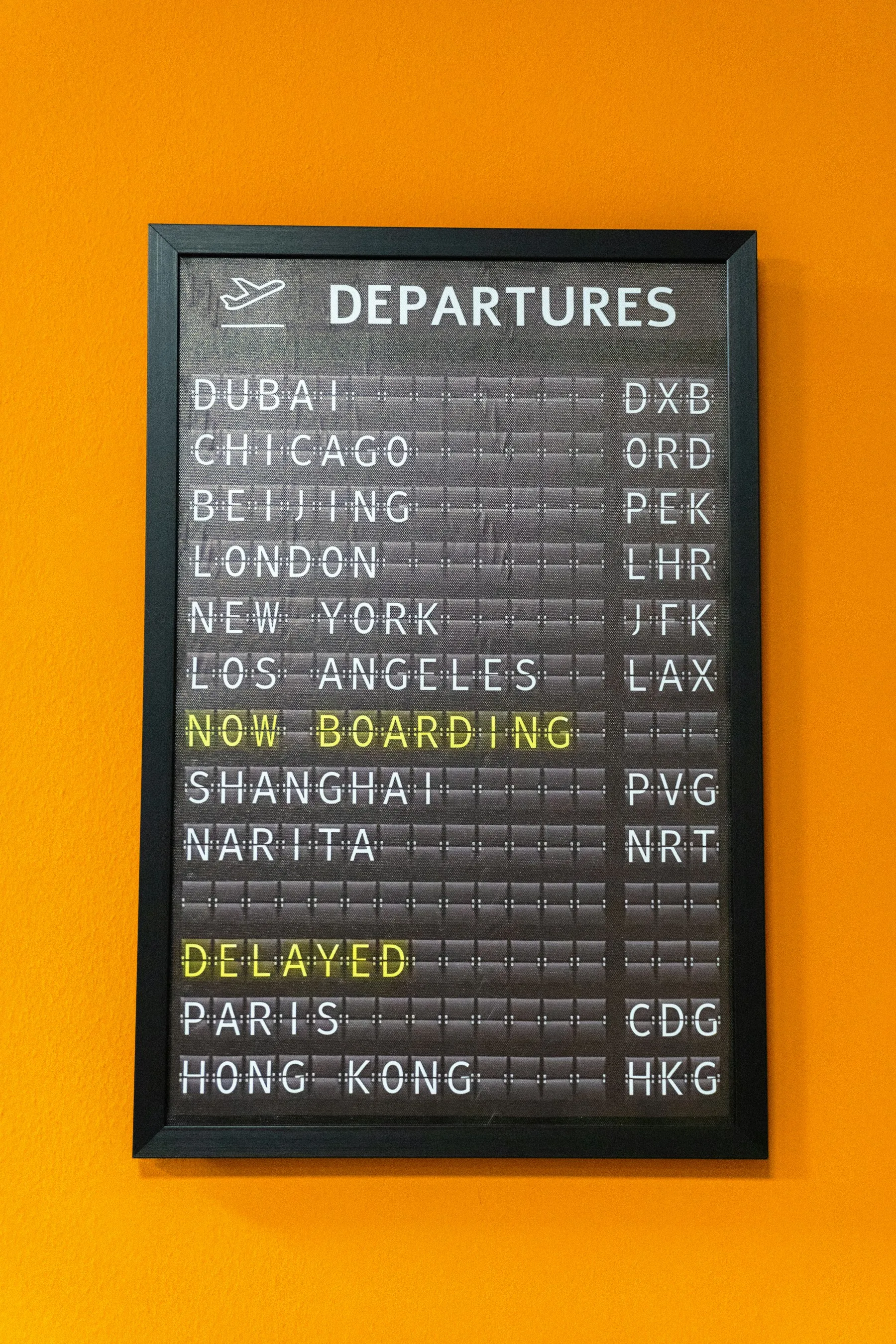 A departure board with destinations and flight status